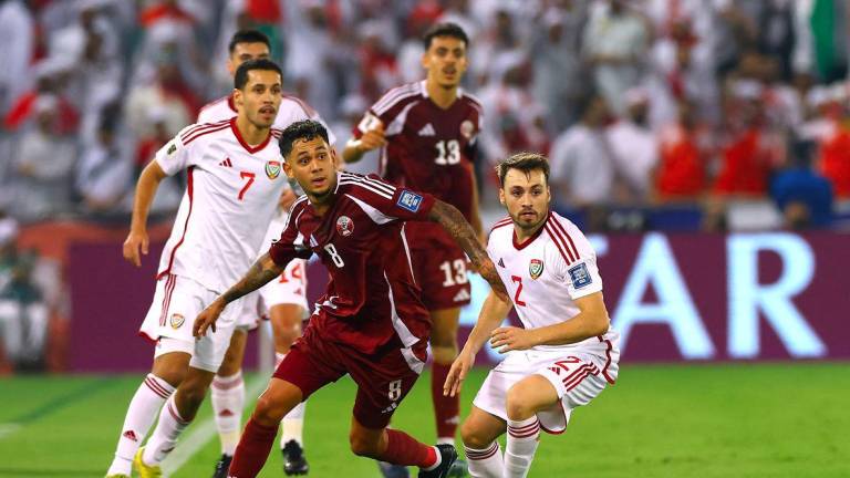 Football - FIFA World Cup - AFC Qualifiers - Group A - Qatar v United Arab Emirates - Jassim Bin Hamad Stadium, Doha, Qatar - October 14, 2025Qatar's Edmilson Junior in action with United Arab Emirates' Ruben Amaral - REUTERSPIX