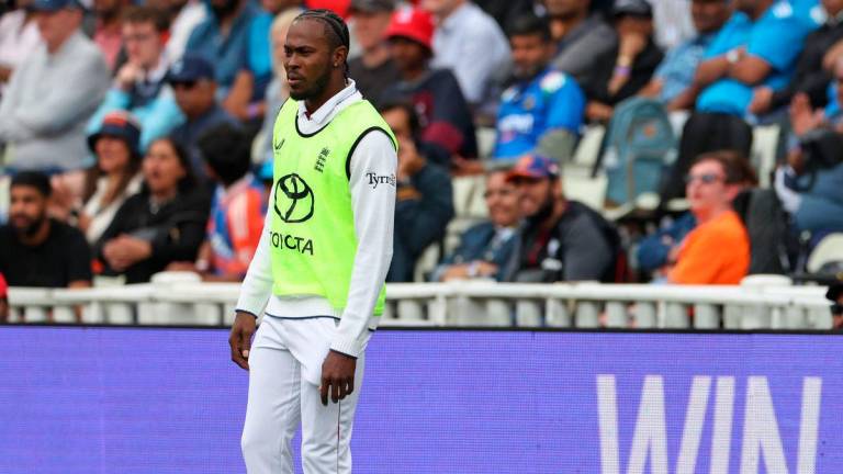 Non-playing bowler, England’s Jofra Archer watches from the boundary rope on day four of the second cricket test match between England and India at Edgbaston cricket ground in Birmingham, central England on July 5, 2025. (Photo by Darren Staples / AFP)