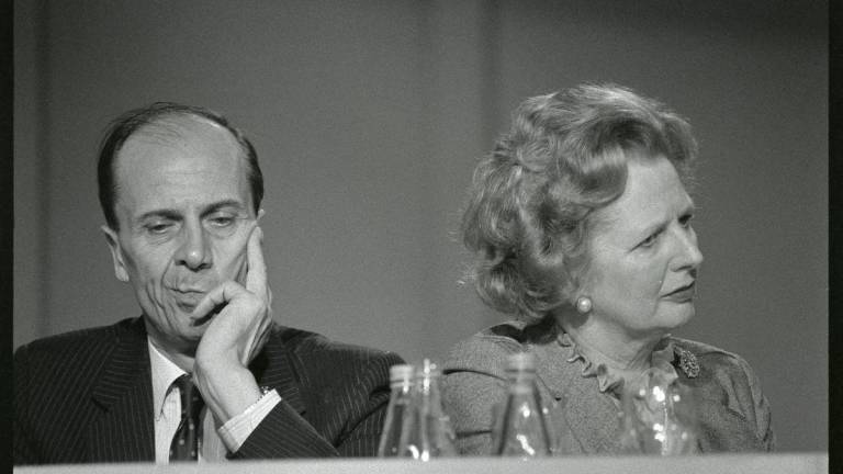 Britain’s Prime Minister Margaret Thatcher listens to speeches with Conservative Party Chairman Norman Tebbit at the Party Conference in Blackpool, England. October 10, 1985 REUTERS/Roy Letkey/File Photo.