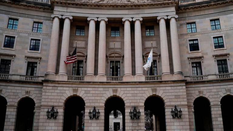 FILE PHOTO: People walk outside the headquarters of the United States Environmental Protection Agency (EPA) in Washington, D.C., U.S., February 18, 2025. REUTERS/Kent Nishimura/File Photo