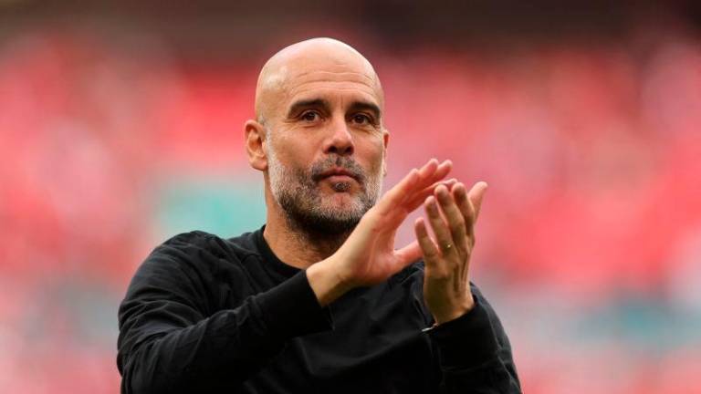 Manchester City manager Pep Guardiola applauds fans after the match REUTERSpix