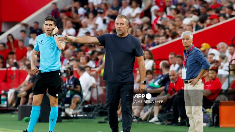 Barcelona's German coach Hansi Flick gestures during the Spanish league football match between RCD Mallorca and FC Barcelona at Mallorca Son Moix Stadium in Palma de Mallorca on August 16, 2025. - AFPPIX