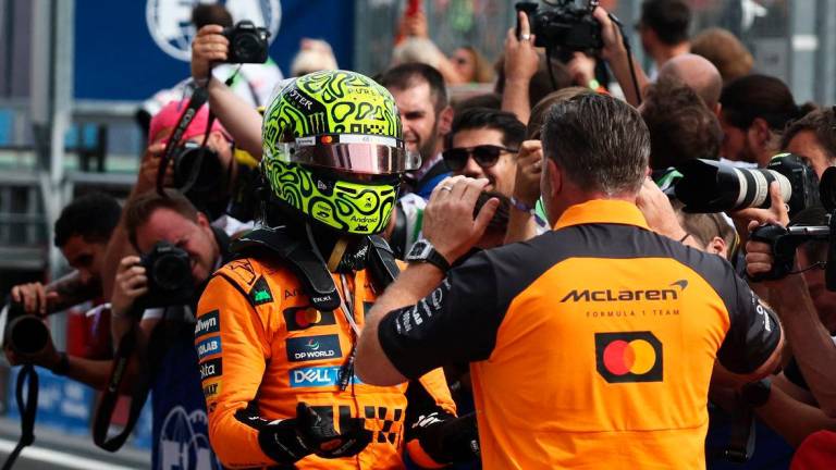 McLaren’s Lando Norris celebrates with McLaren chief executive Zak Brown after winning the Hungarian Grand Prix - Reuters