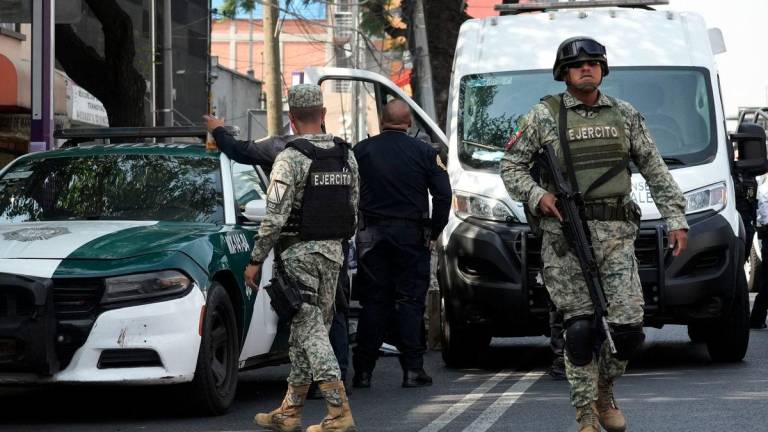 Army soldiers patrol near the crime scene of the killing of Jose Munoz and Ximena Guzman in Mexico city on May 20, 2025. Gunmen on a motorcycle shot dead Munoz and Guzman, an aide to Mexico City Mayor Clara Brugada, at a busy avenue in the capital on May 20, 2025, authorities said. AFPpix
