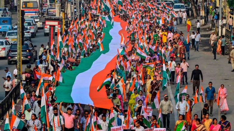 People holding Indian national flags take part in a rally, expressing solidarity with the armed forces in Guwahati on May 14, 2025. AFPpix