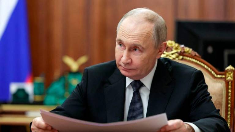 Russian President Vladimir Putin attends a meeting with Moscow Mayor Sergei Sobyanin at the Kremlin in Moscow, Russia May 5, 2025. REUTERSpix