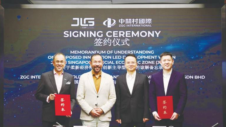 From left: Akmal, Johor Corporation president &amp; CEO, and JLG chairman Datuk Syed Mohamed Syed Ibrahim, ZGC International Holding Ltd chairman Zhou Rui and general manager Lu Jiang.