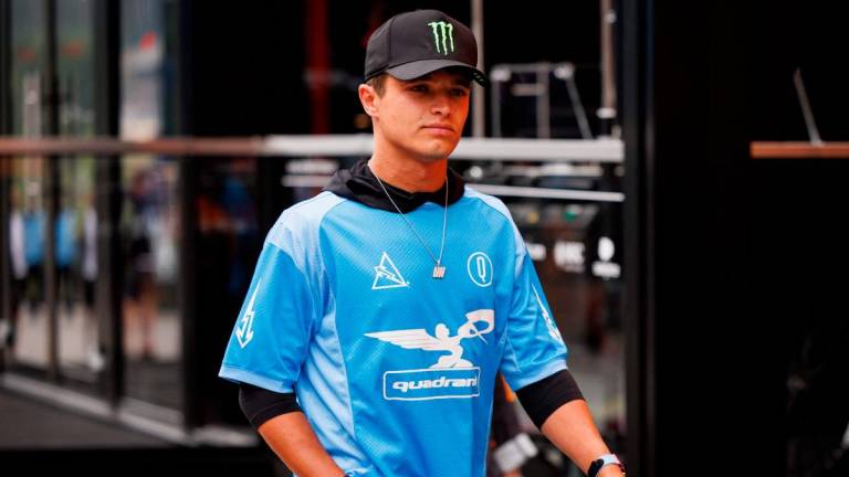 McLaren’s British driver Lando Norris walks down the paddock ahead of the Formula One Belgian Grand Prix at the Spa-Francorchamps Circuit in Spa, on July 24, 2025. Photo by Simon Wohlfahrt / AFP