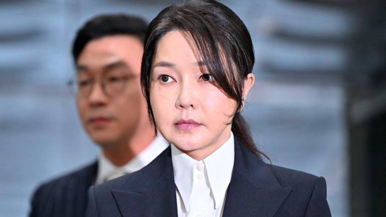 South Korea's former first lady Kim Keon Hee, wife of impeached former president Yoon Suk Yeol, arrives at a court to attend a hearing to review her arrest warrant requested by special prosecutors at the Seoul Central District Court, in Seoul, South Korea August 12, 2025. - Jung Yeon-je/Pool via REUTERSPIX