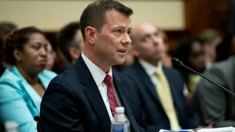 'FBI lover' agent rejects Trump bias charges in stormy hearing