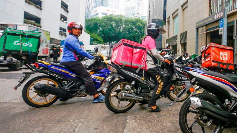 Balakrishnan said the prevalence of ride hailing service workers and delivery riders reflect the rise of flexible, tech-driven jobs that universities must prepare graduates to navigate. – ADAM AMIR HAMZAH/THESUN