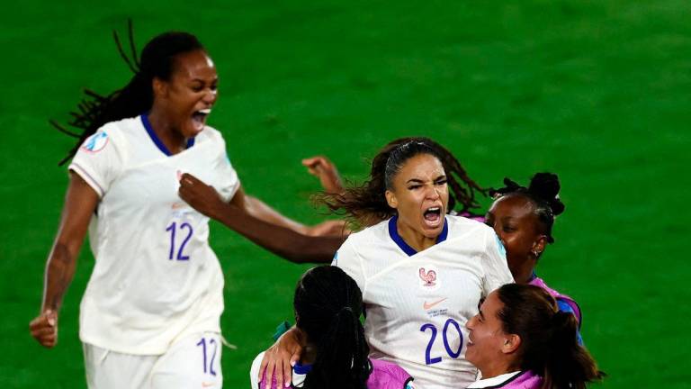 France’s Delphine Cascarino celebrates scoring their third goal with teammates REUTERS/Stephane Mahe TPX IMAGES OF THE DAY