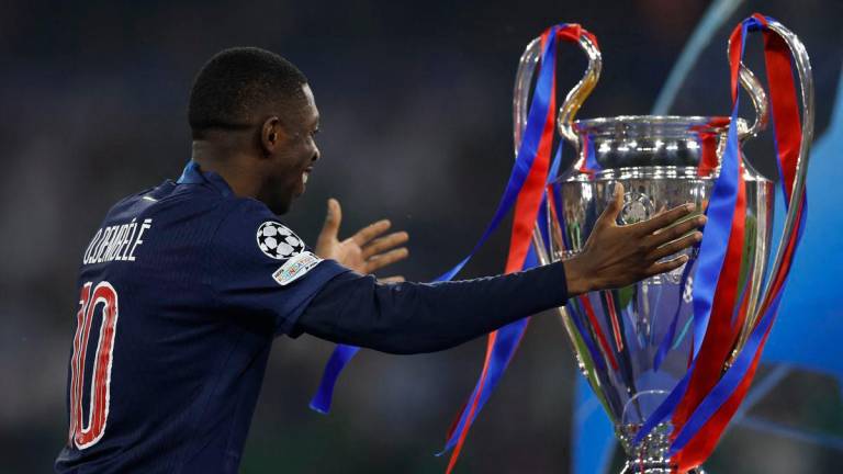 Paris St Germain’s Ousmane Dembele with the trophy after collecting his winners medal REUTERS/Peter Cziborra