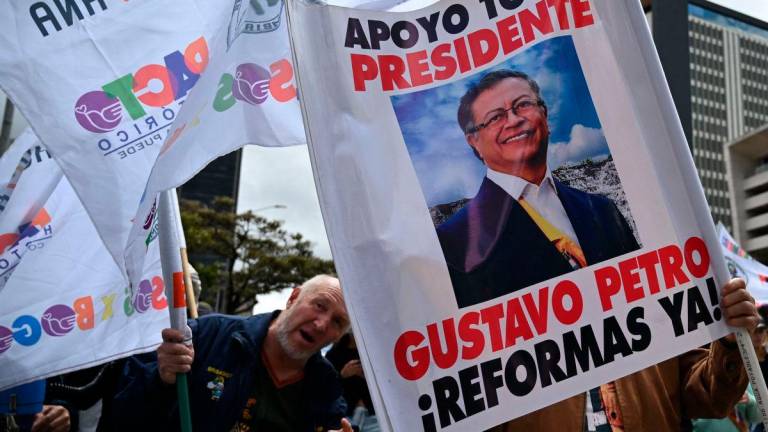 People wave allusive signs and flags during a march in favor of the reforms proposed by Colombia’s President Gustavo Petro during a strike called by unions in Bogota, Colombia, on May 28, 2025. AFPpix