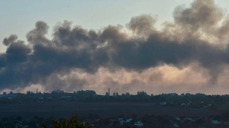 Smoke rises from the city during a Russian drone and missile strike, amid Russia’s attack on Ukraine, in Dnipro, Ukraine September 20, 2025. REUTERS/Mykola Synelnykov