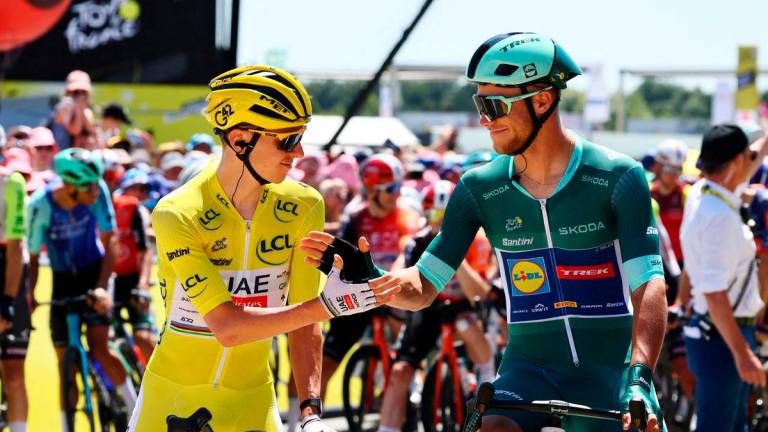 UAE Team Emirates XRG’s Tadej Pogacar wearing the yellow jersey shakes hands with Lidl - Trek’s Jonathan Milan wearing the green jersey before the start of stage 8 - REUTERS