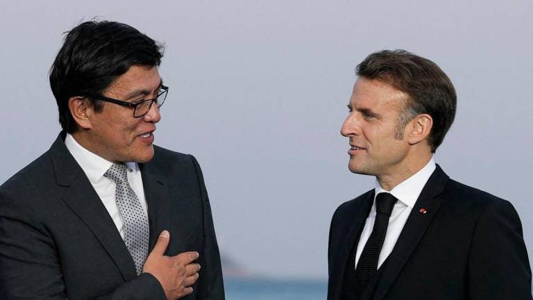 French President Emmanuel Macron (R) meets with Edil Baisalov, deputy prime minister in government of Kyrgyz Republic before a dinner ahead of the third United Nations Ocean Conference (UNOC3), in the French Riviera city of Nice, on June 8, 2025.