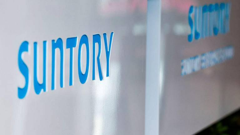 Suntory Holdings' logo on the day of a press conference after its Chairman Takeshi Niinami has submitted his resignation after becoming the subject of a cannabis law violation, in Tokyo, Japan September 2, 2025. - REUTERSPIX