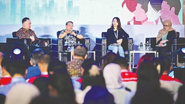 Zurkarnain (second from left) and Sim (second from right) during a panel discussion at ‘The Future of Connectivity: Advancing Digital Inclusion Through Transformative Technologies’ forum in Cyberview Resort on Saturday. – Bernamapic