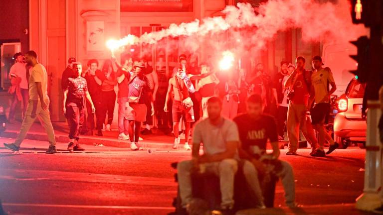Paris Saint-Germain (PSG) supporters gather holding flares on a street in Paris early June 1, 2025, during celebrations following their 5-0 victory in the UEFA Champions League final football match between Paris Saint-Germain (PSG) and Inter Milan held in Munich.. AFPpix