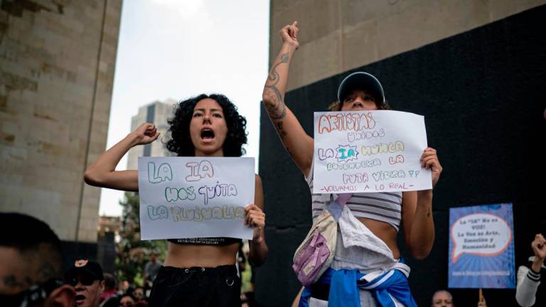 Demonstrators participate in a protest organized by film and music industry workers to demand regulation of AI in the creative sector at the Monument to the Revolution in Mexico City on July 13, 2025. (Photo by Carl de Souza / AFP)