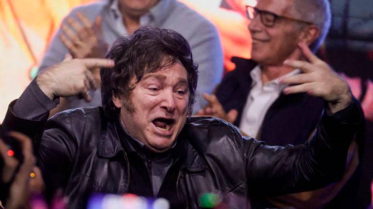 Argentina’s President Javier Milei reacts onstage at the La Libertad Avanza party headquarters on the day of the legislative elections of the city of Buenos Aires, Argentina, May 18, 2025. REUTERSpix