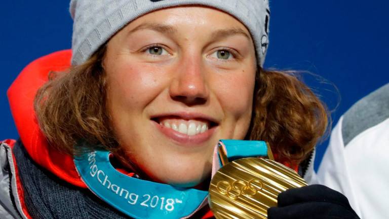 Gold medallist Laura Dahlmeier of Germany on the podium- REUTERS