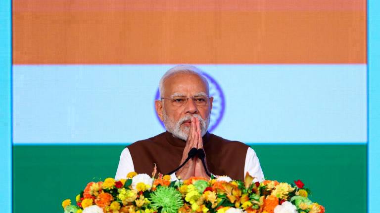 India’s Prime Minister Narendra Modi gestures as he delivers a speech at the India-Japan Economic Forum in Tokyo, Japan August 29, 2025. REUTERS/Issei Kato