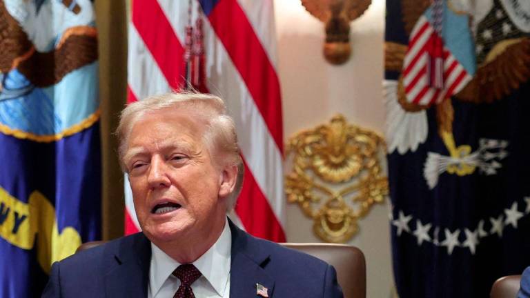 U.S. President Donald Trump reacts during a cabinet meeting at the White House in Washington, D.C., U.S., August 26, 2025. - REUTERSPIX