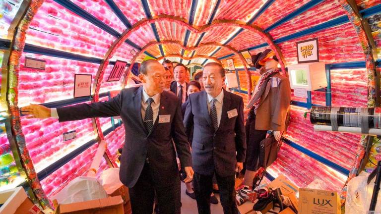 Tan (right) with Tzu Chi commission member and Top Glove executive chairman Tan Sri Dr Lim Wee Chai during the opening ceremony of the interactive exhibition at Jing Si Hall in Kepong to celebrate the foundation’s 30th anniversary. – ADIB RAWI YAHYA/THESUN