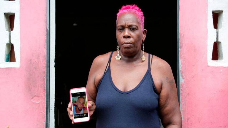 Lynette Burnley who believes her nephew Chad Joseph was killed in a U.S. military strike on a boat in the Caribbean, shows a photo of Joseph as his family demands evidence to support President Donald Trump’s claim that the victims were drug traffickers, in Las Cuevas, Trinidad and Tobago October 16, 2025. - REUTERSPIX