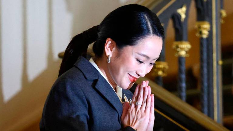 Thailand’s Paetongtarn Shinawatra, who was dismissed as prime minister, gestures as she arrives for a press conference after the Constitutional Court ruled to remove her from office in a high-profile ethics case, following a leaked phone conversation between her and Cambodia’s former leader Hun Sen, at Government House in Bangkok, Thailand, August 29, 2025. REUTERS/Athit Perawongmetha