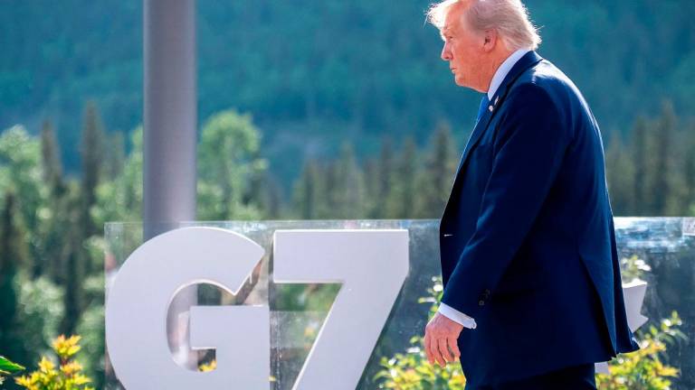 US President Donald Trump arrives for a family photo during the Group of Seven (G7) Summit at the Kananaskis Country Golf Course in Kananaskis, Alberta, Canada on June 16, 2025. - Michael Kappeler / POOL / AFP