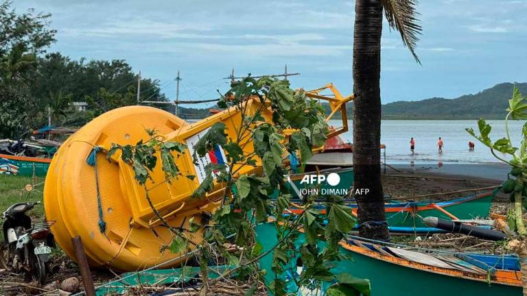 A navigational buoy is washed ashore at the height of Super Typhoon Ragasa in Santa Ana town, Cagayan province, north of Manila on September 23, 2025 - (Photo by John Dimain / AFP)