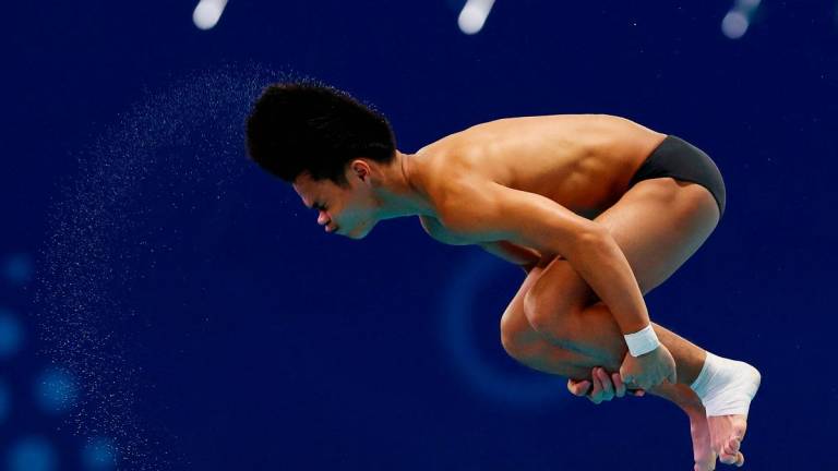 Diving - World Aquatics Championships - Diving Men’s 10m platform - Semi Final - OCBC Aquatic Centre, Singapore - August 3, 2025 Malaysia’s Elvis Priestly Anak Clement in action - REUTERS/Jeremy Lee