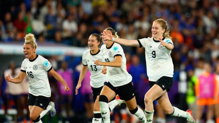 Germany’s Sjoeke Nusken, Germany’s Linda Dallmann and Germany’s Klara Buhl celebrate after winning the penalty shootout REUTERS
