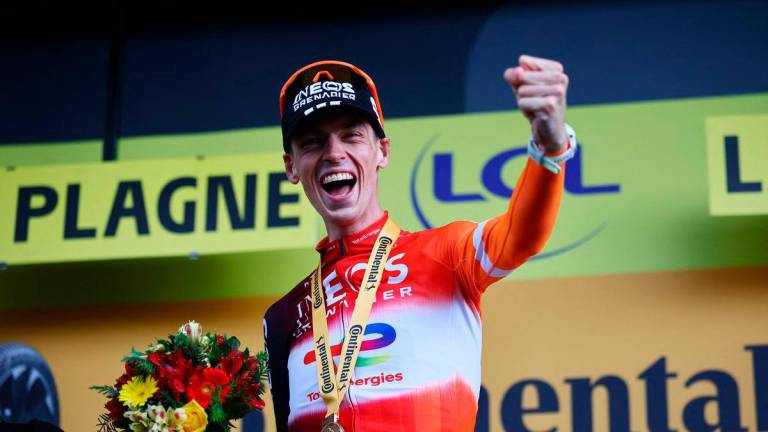 Ineos Grenadiers’ Thymen Arensman celebrates on the podium after winning stage 19 -REUTERSpix