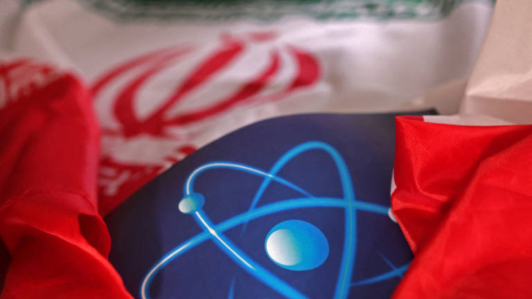 Atomic symbol and Iranian flag are seen in this illustration taken September 8, 2022. - REUTERS