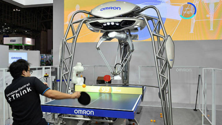 Smash hit: Ping pong robot takes on Olympian at Tokyo tech fair