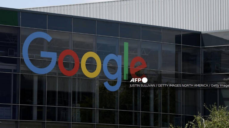 A sign is posted on the exterior of a building on the Google headquarters campus on July 23, 2025 in Mountain View, California. - Getty Images via AFP