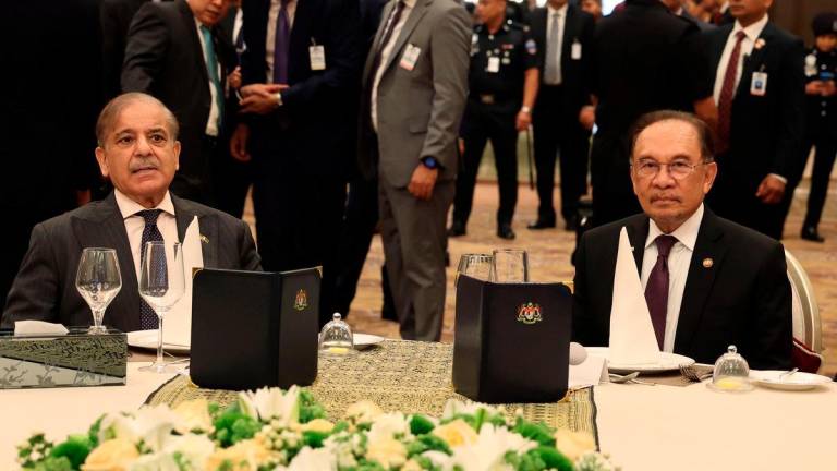 Prime Minister Datuk Seri Anwar Ibrahim (right) is with Pakistan’s Prime Minister Muhammad Shehbaz Sharif at the luncheon hosted by the Prime Minister at Seri Perdana Complex today. - BERNAMA