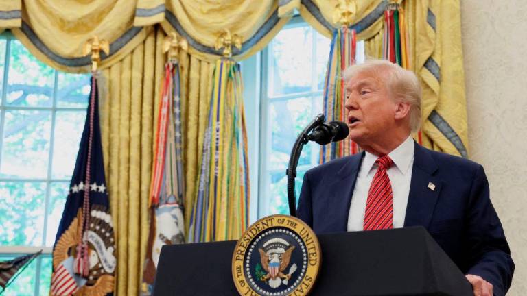 U.S. President Donald Trump takes questions from the media following former U.S. Senator David Perdue’s swearing-in ceremony to be the new U.S. ambassador to China, at the White House in Washington, D.C., U.S., May 7, 2025. REUTERS
