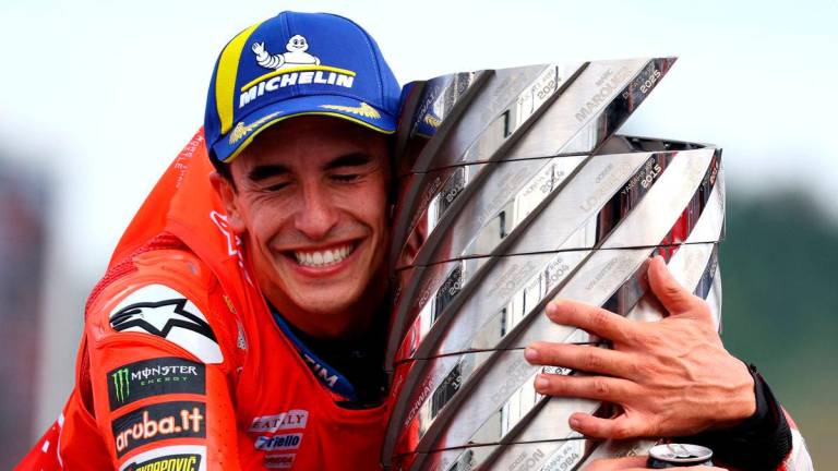 Ducati Lenovo Team’s Marc Marquez celebrates with the trophy after winning the 2025 MotoGP World Championship REUTERS/Kim Kyung-Hoon TPX IMAGES OF THE DAY