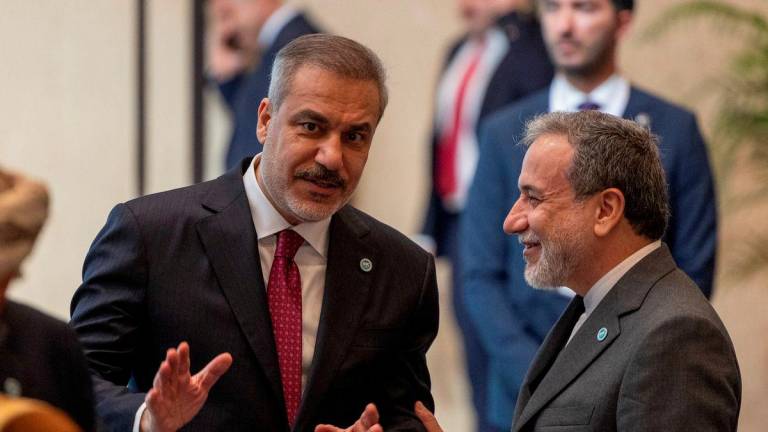 Iranian Foreign Minister Abbas Araghchi talks with Turkish Foreign Minister Hakan Fidan during the 51st Session of the Council of Foreign Ministers of the Organisation of Islamic Cooperation (OIC) in Istanbul, Turkey, June 21, 2025. - REUTERSPIX