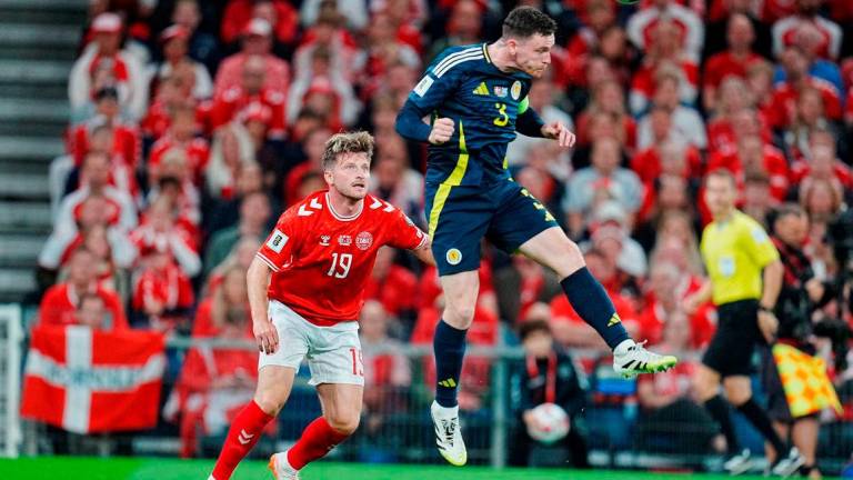 Denmark’s Anders Dreyer in action with Scotland’s Andrew Robertson, Liselotte Sabroe/Ritzau Scanpix via REUTERS