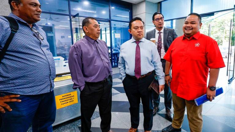 Datuk Wan Saiful Wan Jan (C). - ADIB RAWI YAHYA/THESUN