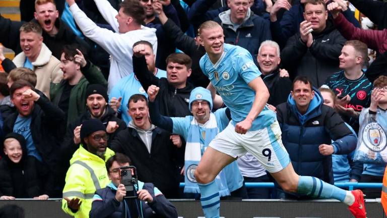 Manchester City's Norwegian striker #09 Erling Haaland celebrates after scoring their second goal during the English Premier League football match between Manchester City and Wolverhampton Wanderers at the Etihad Stadium in Manchester, north west England, on May 4, 2024. - AFPPIX