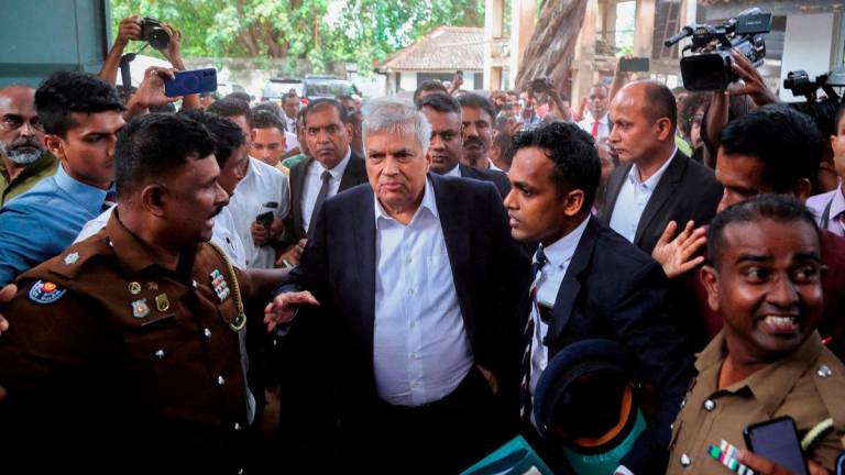 Sri Lanka's former President Ranil Wickremesinghe arrives at the Magistrate’s Court in Colombo, Sri Lanka, August 22, 2025. - REUTERS