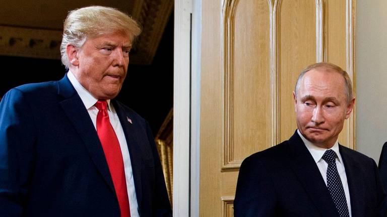 (FILES) US President Donald Trump (L) and Russian President Vladimir Putin arrive for a meeting in Helsinki on July 16, 2018. US President Donald Trump said on August 8, 2025 he would meet with Russian counterpart Vladimir Putin on August 15 in Alaska, as the Republican billionaire hopes to help mediate an end to the war in Ukraine. Photo by Brendan Smialowski / AFP