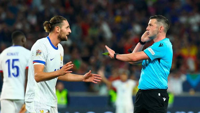 For representational purposes only.France’s Adrien Rabiot with referee Michael Oliver after conceding a penalty REUTERS